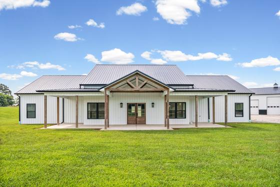 Front elevation, board-and-batten with a standing-seam metal roof