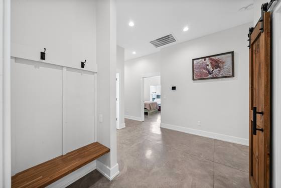 Drop zone and hallway with sliding barn door