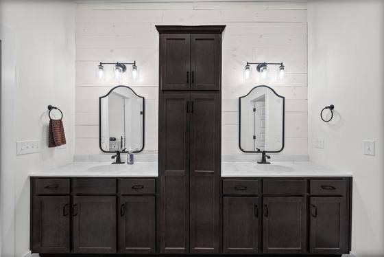 Primary bath with double vanities and center tower