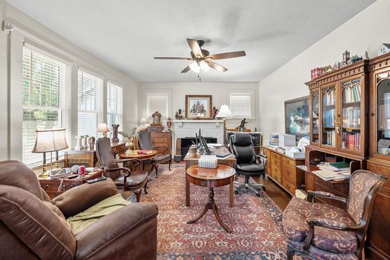 Living room toward the fireplace and front windows