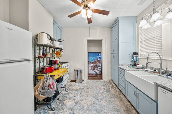Kitchen toward the farmhouse sink and side entry