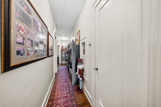 Hallway with linen and coat closets