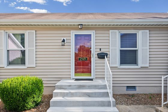 Covered front stoop and entry door at 2949 Pawnee Drive
