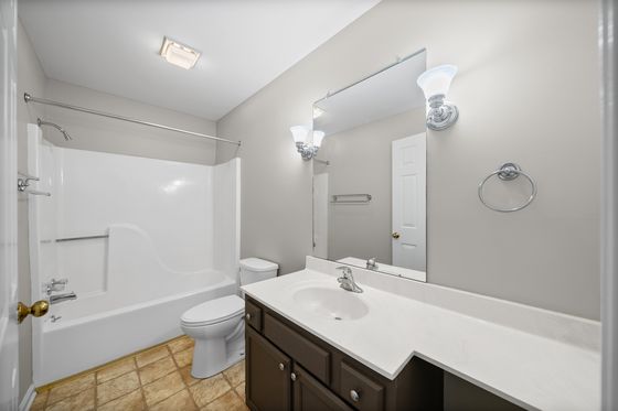 Full bathroom with tub and shower combination and vanity