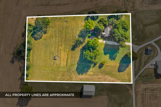 The parcel outlined (property lines approximate) - open grass with the house at the top corner, 5525 Glass Lane