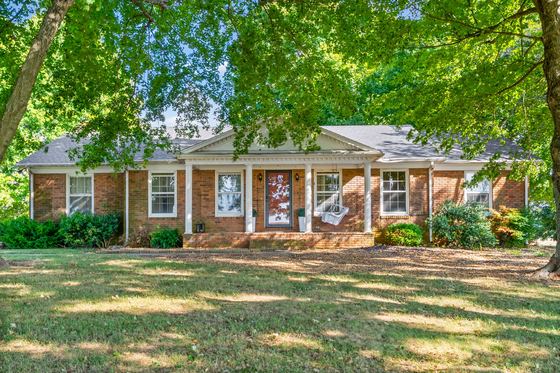 Straight on: an all-brick ranch with a columned front porch, 5525 Glass Lane